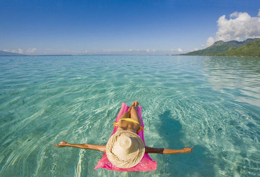 French Polynesia, Tahiti, Moorea, Woman Floating In Water Wall Mural