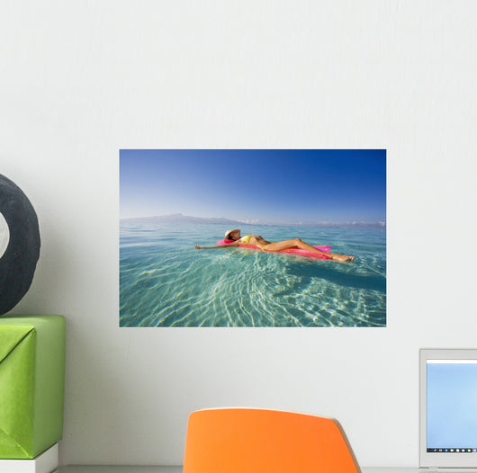French Polynesia, Tahiti, Moorea, Woman Floating In Water Wall Mural