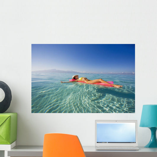 French Polynesia, Tahiti, Moorea, Woman Floating In Water Wall Mural