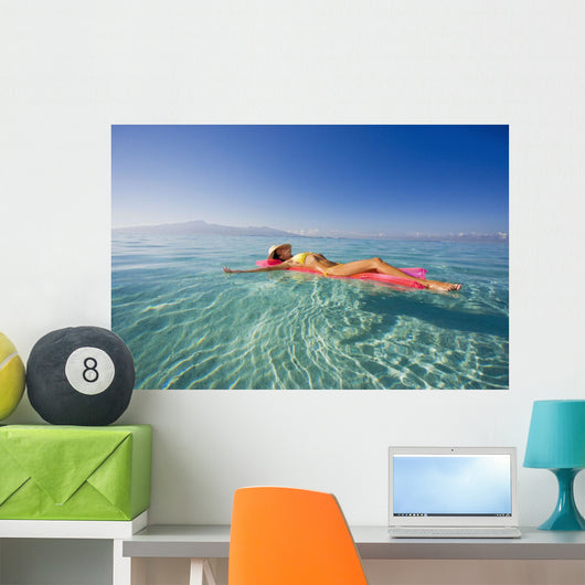 French Polynesia, Tahiti, Moorea, Woman Floating In Water Wall Mural