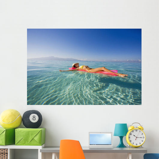French Polynesia, Tahiti, Moorea, Woman Floating In Water Wall Mural