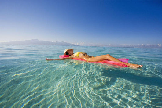 French Polynesia, Tahiti, Moorea, Woman Floating In Water Wall Mural