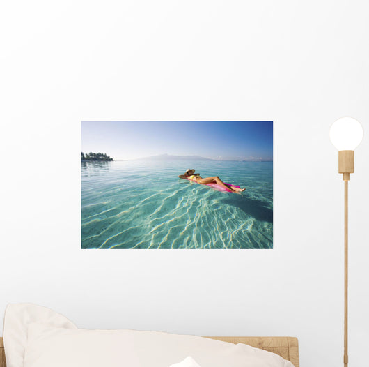 French Polynesia, Tahiti, Moorea, Woman Floating In Water Wall Mural