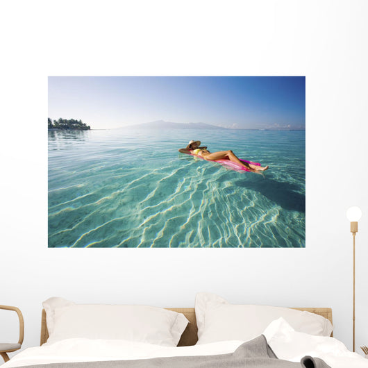 French Polynesia, Tahiti, Moorea, Woman Floating In Water Wall Mural
