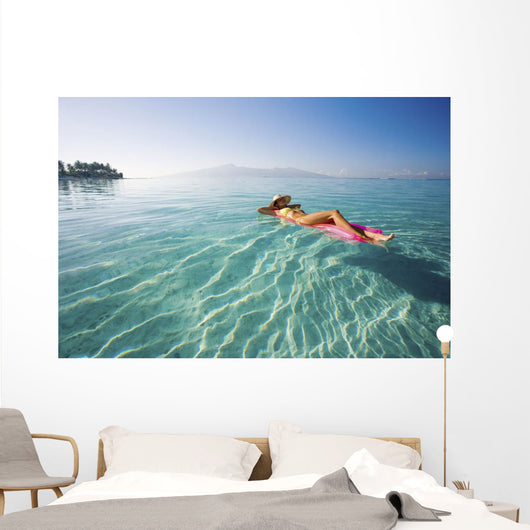 French Polynesia, Tahiti, Moorea, Woman Floating In Water Wall Mural