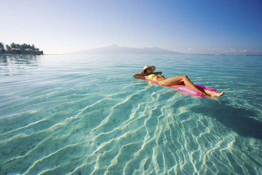 French Polynesia, Tahiti, Moorea, Woman Floating In Water Wall Mural