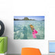 French Polynesia, Moorea, Woman Free Diving In Turquoise Ocean Wall Mural