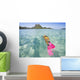 French Polynesia, Moorea, Woman Free Diving In Turquoise Ocean Wall Mural