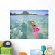 French Polynesia, Moorea, Woman Free Diving In Turquoise Ocean Wall Mural