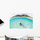 French Polynesia, Moorea, Woman Free Diving In Turquoise Ocean Wall Mural