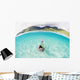 French Polynesia, Moorea, Woman Free Diving In Turquoise Ocean Wall Mural