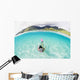 French Polynesia, Moorea, Woman Free Diving In Turquoise Ocean Wall Mural