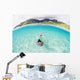 French Polynesia, Moorea, Woman Free Diving In Turquoise Ocean Wall Mural