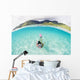 French Polynesia, Moorea, Woman Free Diving In Turquoise Ocean Wall Mural
