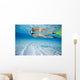 French Polynesia, Moorea, Woman Free Diving In Turquoise Ocean Wall Mural