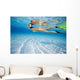 French Polynesia, Moorea, Woman Free Diving In Turquoise Ocean Wall Mural