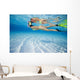 French Polynesia, Moorea, Woman Free Diving In Turquoise Ocean Wall Mural