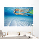 French Polynesia, Moorea, Woman Free Diving In Turquoise Ocean Wall Mural