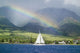 Rainbow In Front Of West Mauis Mountain Range With Sailboat In Ocean Wall Mural
