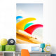 Colorful Surfboards Fins, Bright Sunny Sky In Background Wall Mural