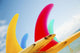 Colorful Surfboards Fins, Bright Sunny Sky In Background Wall Mural