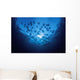 Ecuador, School of Cownose Rays swimming close to water surface Wall Mural