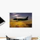 USA, Silhouette of airplane in sunset sky Wall Mural