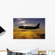 USA, Silhouette of airplane in sunset sky Wall Mural
