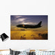 USA, Silhouette of airplane in sunset sky Wall Mural