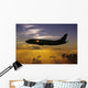 USA, Silhouette of airplane in sunset sky Wall Mural