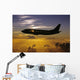 USA, Silhouette of airplane in sunset sky Wall Mural