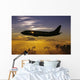 USA, Silhouette of airplane in sunset sky Wall Mural
