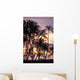 Palm trees and a couple in beach chairs at sunset at Anaehoomalu Bay Wall Mural