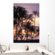 Palm trees and a couple in beach chairs at sunset at Anaehoomalu Bay Wall Mural