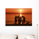 USA, Hawaii, Oahu, Boys holding canoe at sunset Wall Mural
