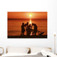 USA, Hawaii, Oahu, Boys holding canoe at sunset Wall Mural