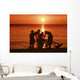 USA, Hawaii, Oahu, Boys holding canoe at sunset Wall Mural
