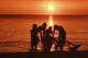 USA, Hawaii, Oahu, Boys holding canoe at sunset Wall Mural