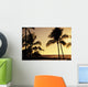 Ocean and silhouetted palm trees at sunset in Mauna Lani Resort Wall Mural