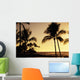Ocean and silhouetted palm trees at sunset in Mauna Lani Resort Wall Mural