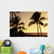 Ocean and silhouetted palm trees at sunset in Mauna Lani Resort Wall Mural