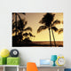Ocean and silhouetted palm trees at sunset in Mauna Lani Resort Wall Mural