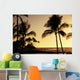 Ocean and silhouetted palm trees at sunset in Mauna Lani Resort Wall Mural