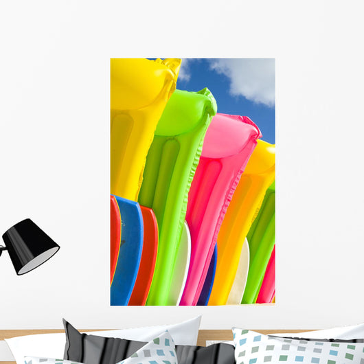 Close-Up View Of Colorful Plastic Rafts And Boogie Boards Wall Mural