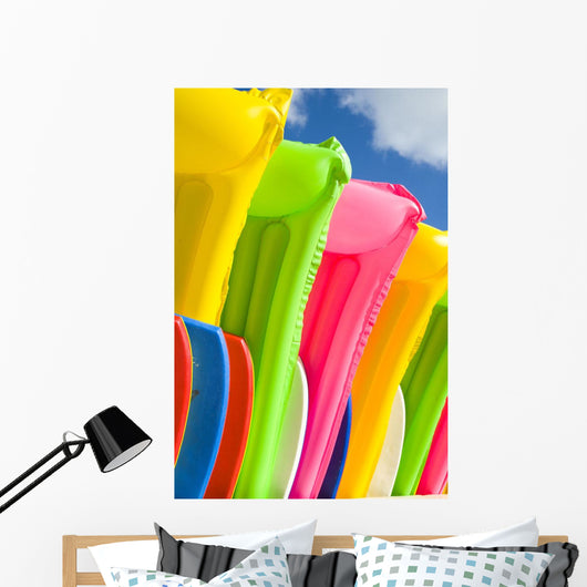 Close-Up View Of Colorful Plastic Rafts And Boogie Boards Wall Mural