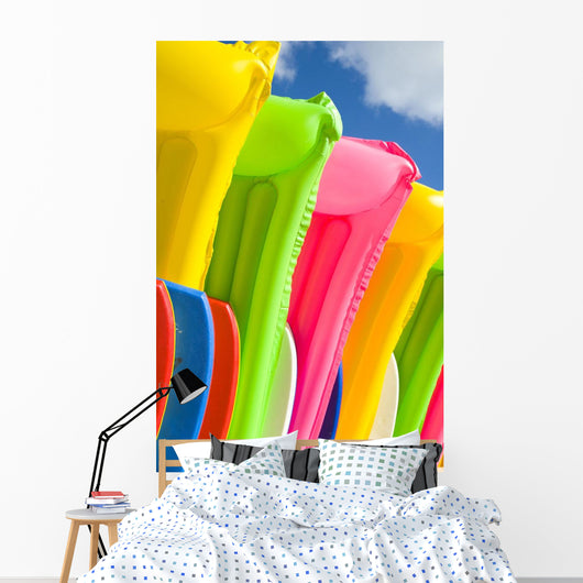 Close-Up View Of Colorful Plastic Rafts And Boogie Boards Wall Mural
