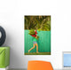 Woman holding red and pink ginger flowers Wall Mural