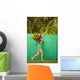 Woman holding red and pink ginger flowers Wall Mural