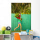Woman holding red and pink ginger flowers Wall Mural