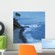 Isolated Tree On A Cliff Overlooking A Pebble Beach Along The Coast Wall Mural